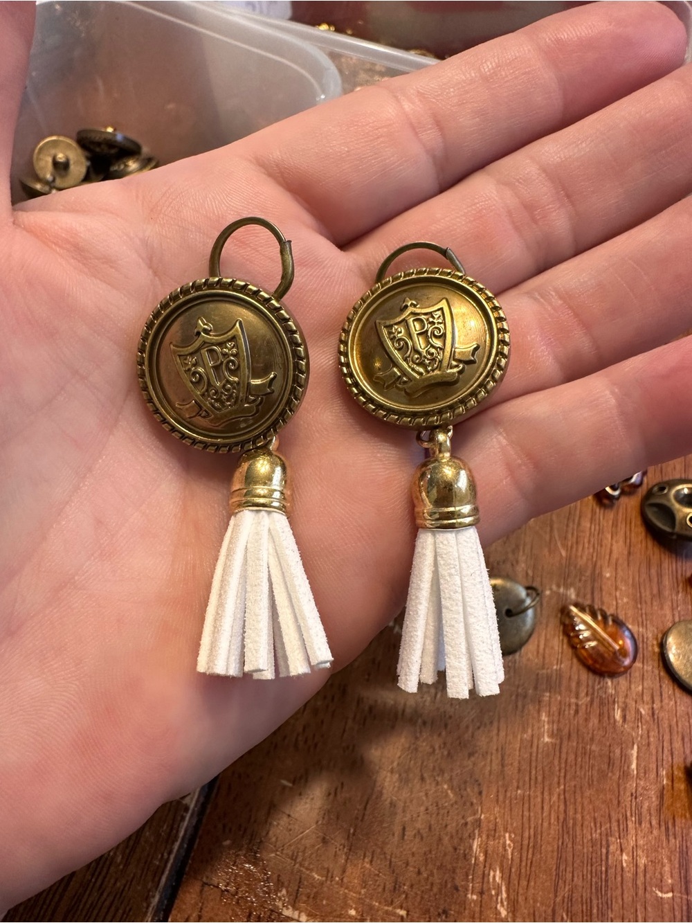 Gold-Tone Shield Drop Earrings with White Tassels